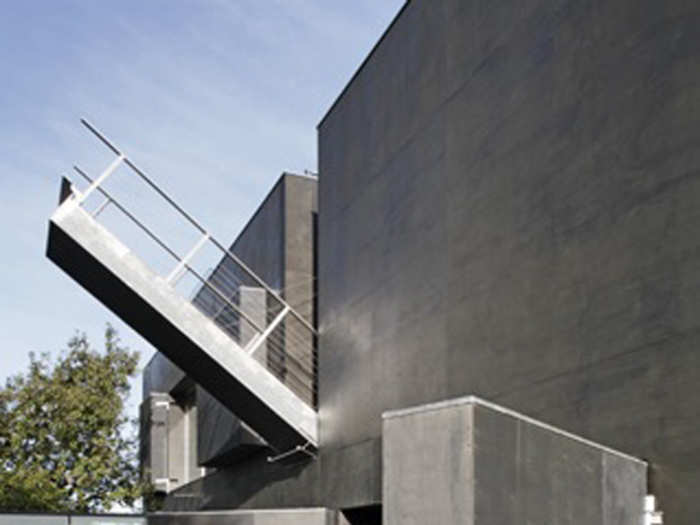 A drawbridge leads to a roof terrace above the pool.