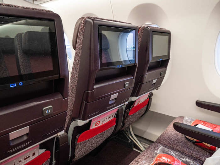 Each seat has an 11-inch in-flight-entertainment screen, equipped with a USB port for charging your phone or other handheld device.