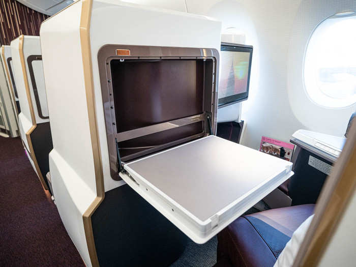 And a large folding tray-table. The placement was fairly unique, but the position can be adjusted so you can squeeze out if you need to use the bathroom during dinner.