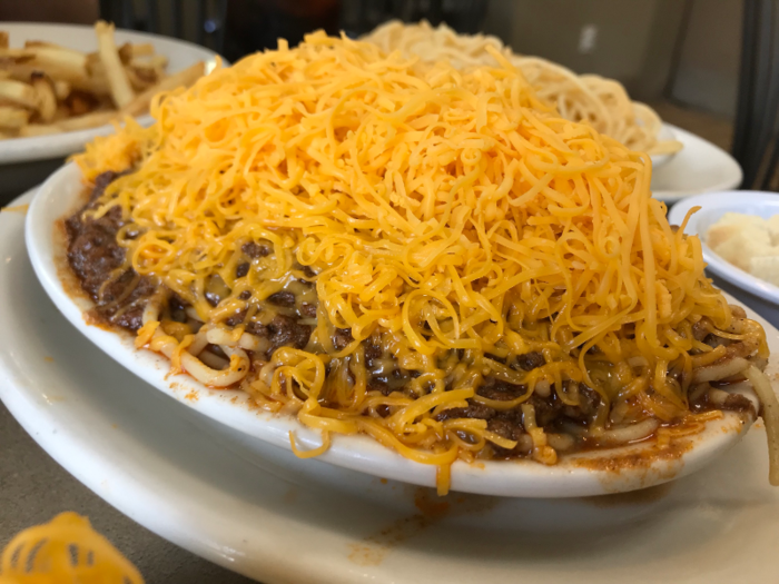 A three-way is spaghetti covered in Skyline’s original chili and shredded cheddar cheese. You can make it a four-way or a five-way by adding diced onions or beans.