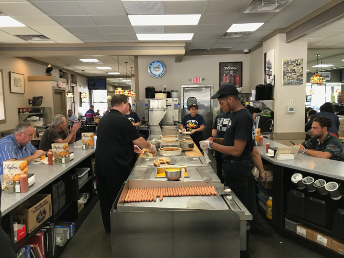 Upon entering, I was greeted by a slew of employees making their signature dishes right behind the counter. Hot dogs, cheese, and chili are certainly not in short supply.