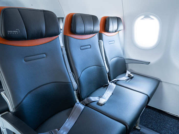 These are the same Collins Aerospace Meridian-made seats as the rest of the cabin, but they offer about 35 inches of pitch.