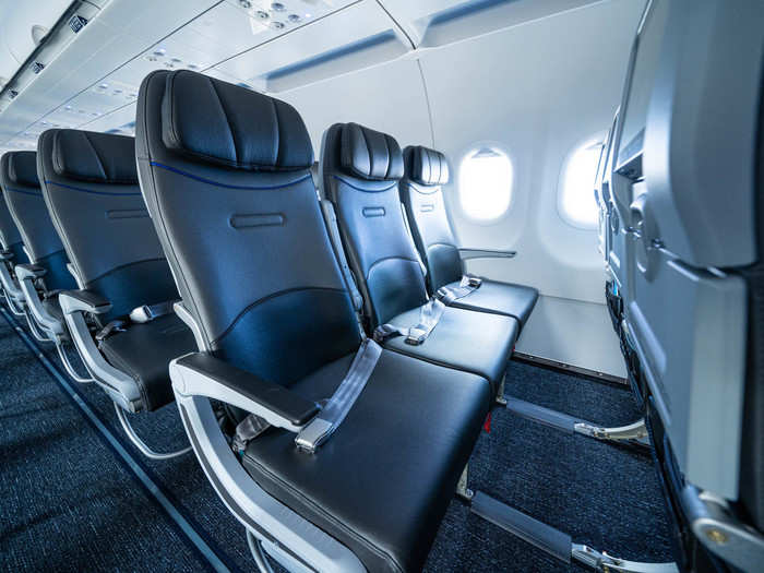 The plane features a sleek, modern look, with brand new seats and pleasant mood lighting (which, obviously, is blue-hued).