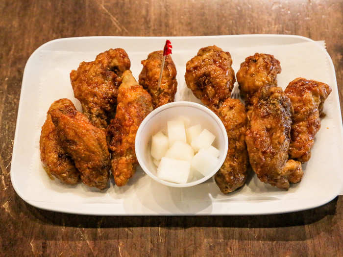 BONCHON — At the Bonchon restaurant in Manhattan that I went to, an order of 10-piece wings cost $13.95. I ordered two flavors: spicy and soy garlic.