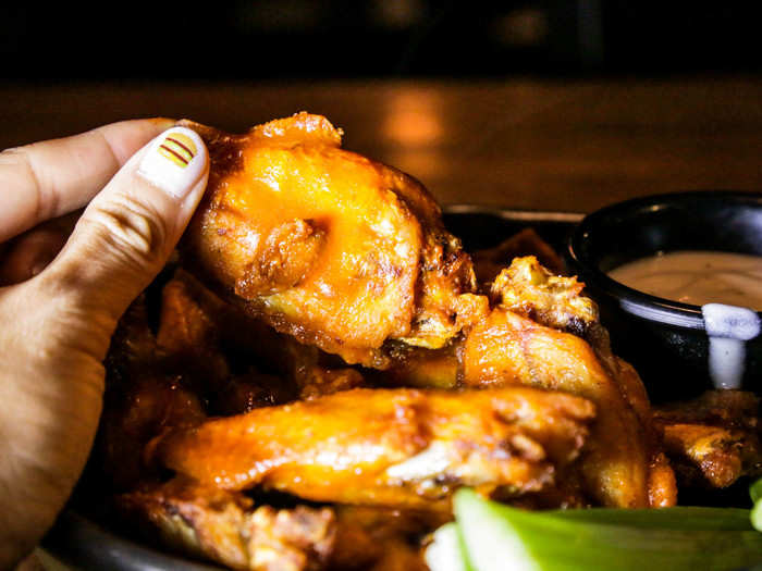 The wings were fragrant and so piping hot that they were practically gushing steam. I suspected that they had spent a couple of minutes rotating in the kitchen microwave.