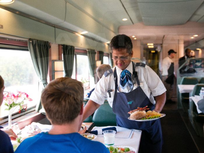 This photo, taken the same year, shows a service attendant on the single-level dining car on a Silver Meteor train traveling to New York from Miami.