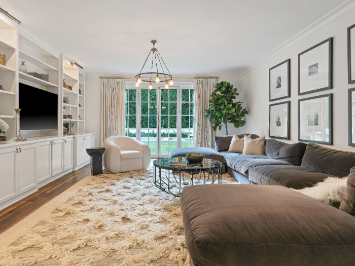 Another living area in the main house features doors that open to the backyard.