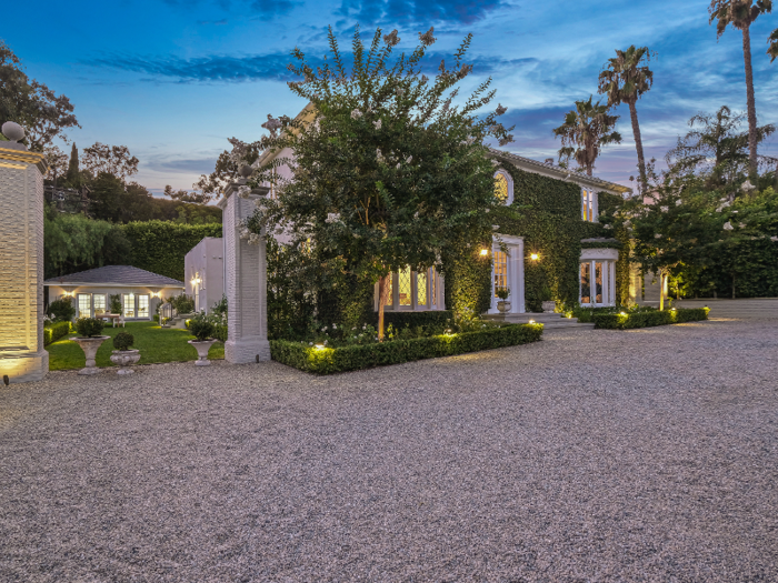 The front of the main house is covered in ivy.