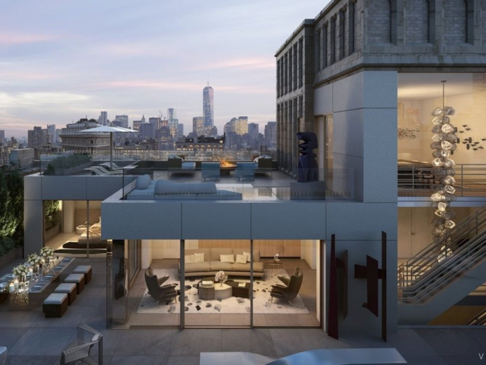 The penthouse unit, which spans the top three floors of the building, has a partial rooftop terrace that spans the entire length of the building.