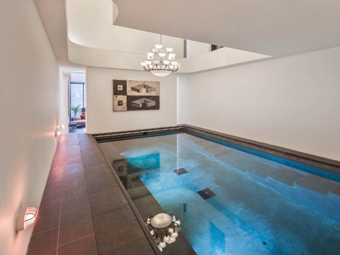 The West Village townhouse includes a 30-foot indoor swimming pool with double-height ceilings and a chandelier.