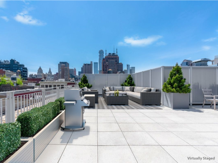 The penthouse includes a massive private roof terrace that spans 932 square feet.