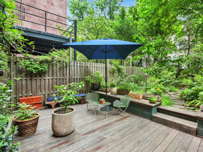 In a city where outdoor space is rare and coveted, the home features a 55-foot-deep backyard garden, complete with an outdoor bathtub and shower.