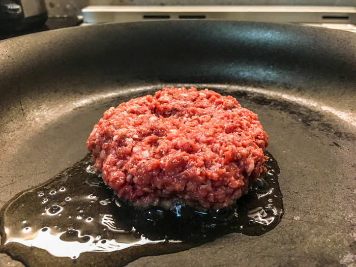 Eventually, though, the oil, pan, and burger all heated up. The "meat" started to sizzle and brown and even leaked grease as a beef burger would.