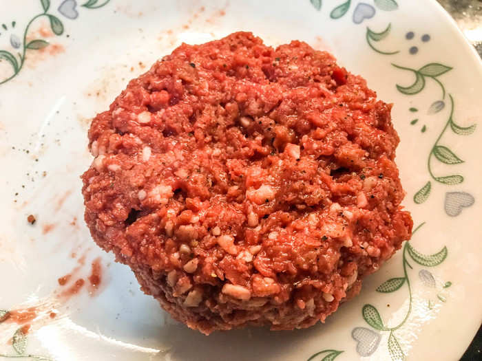 Then, I molded the Impossible grounds into a puck with an indent in the middle. An indent in the center of beef burgers helps ensure that the patty cooks evenly and maintains its shape.