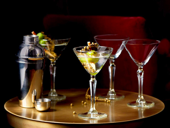 A martini shaker and glasses