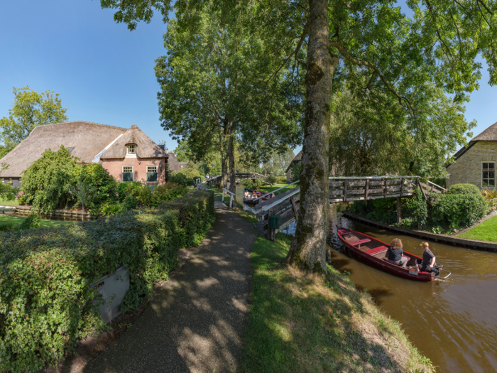 "The downside to this is of course that you’ll be sharing the water [with a] million boats steered by clueless unlicensed boaters," Christina Guan of Happy to Wander wrote in a blog post about her visit to Giethoorn.