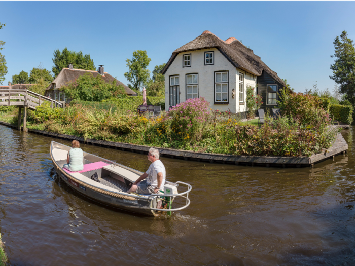 Tourists can rent boats to explore the waterways.