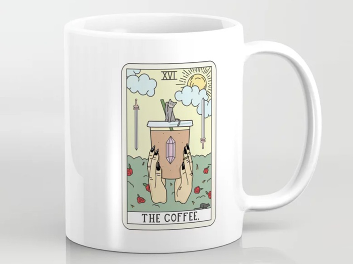 A mug with a "coffee reading" tarot-inspired theme