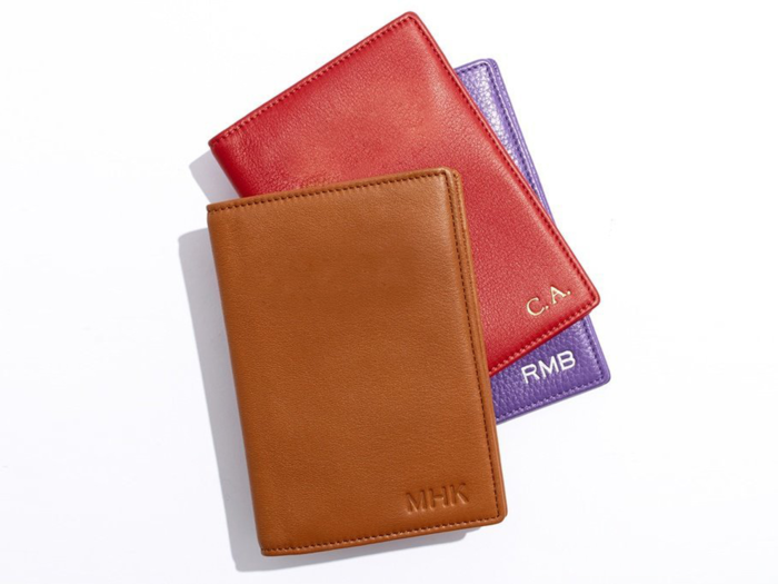 A monogrammed leather passport case