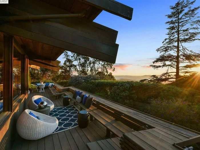 The porch, which wraps around the house, has plenty of room for sitting and taking in views.