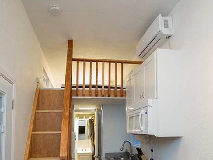 The loft is accessible by stairs, an upgrade from the usual ladders found in tiny houses.