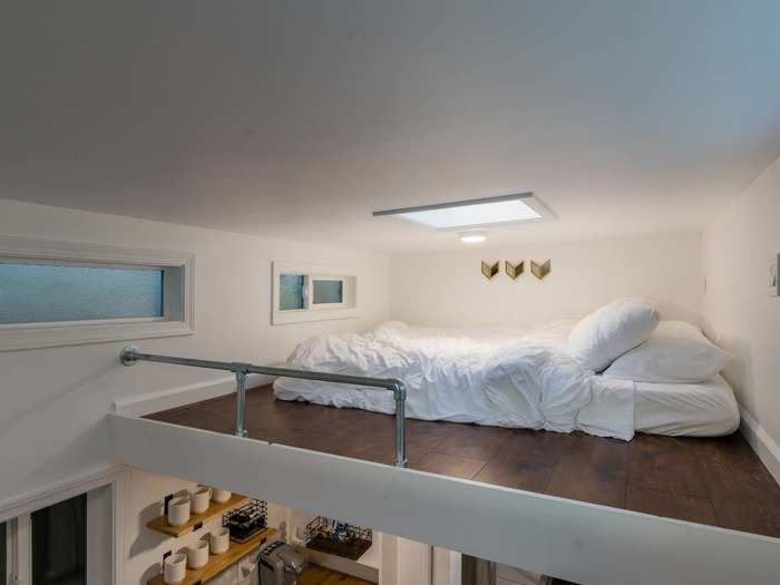 Relax in the sleeping loft, with a queen bed and skylight.