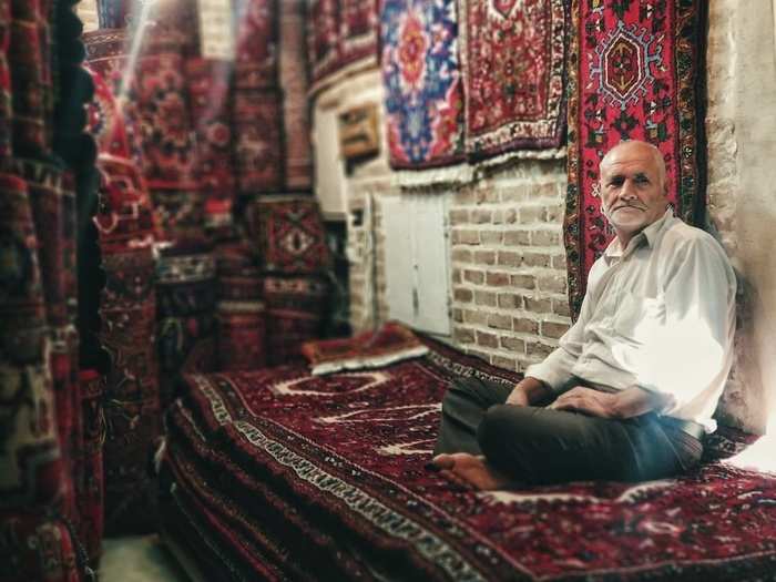 Hashem Sekhavatmand, who has been selling carpets in the city of Tabriz since his teenage years, says he