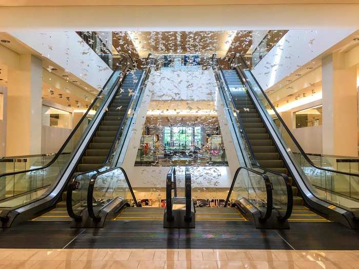 Marble floors, glowing ceilings, and local art installations everywhere — Neiman Marcus doesn