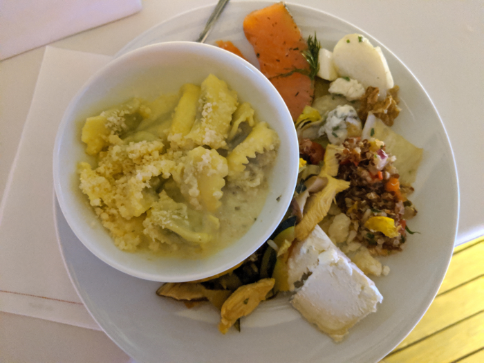 I filled myself a plate of ravioli, cheese, grilled vegetables, quinoa salad, and salmon. The food was so good that I probably could