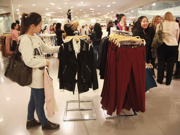 A shopper in Times Square browses the Conde Nast collection in 2012.