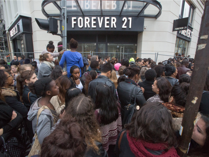 Forever 21 entered Europe to significant fanfare. Here, a crowd gathers for a store opening in Paris.