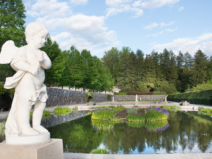 Outside, the estate, which now totals 8,000 acres, includes acres of gardens designed by American landscape architect Frederick Law Olmsted.