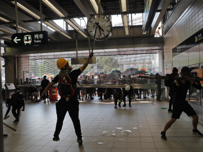 Across the city, 20 train stations were closed down. Operators feared a repeat of an earlier protest, where police used pepper spray on passengers on a stalled train. Here, protesters are seen vandalizing one of the stations.