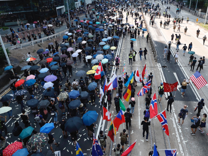 The protesters were urging China to "return power to the people." This was the most simultaneous protests since people began taking to the streets in June.