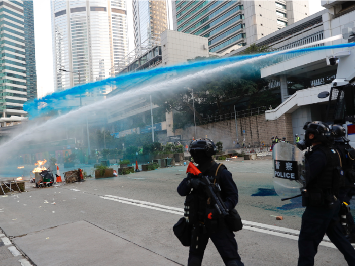 But police rolled out water cannons to douse protesters in staining blue water in order to ensure they were identifiable.