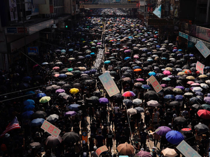 But from midday on, tens of thousands of protesters flooded the streets of Hong Kong to protest China