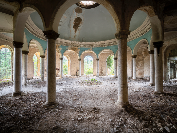 Nature has since claimed the resort as vines, weeds, and moss climb the once ornate and luxurious interiors of this forgotten ghost spa.