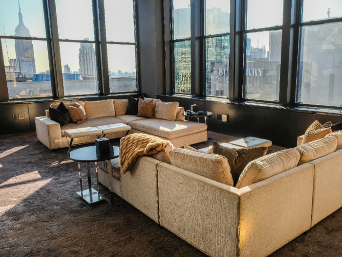 We took the elevator up to the top of the towers and stepped into the Champagne Suite. The formal living room features floor-to-ceiling windows with panoramic views of Manhattan, including the Empire State Building.