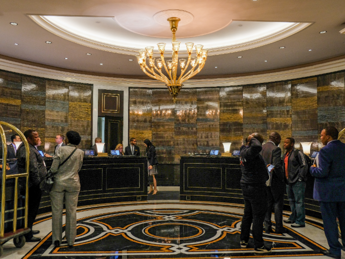 The lobby was bustling with people checking in and out.