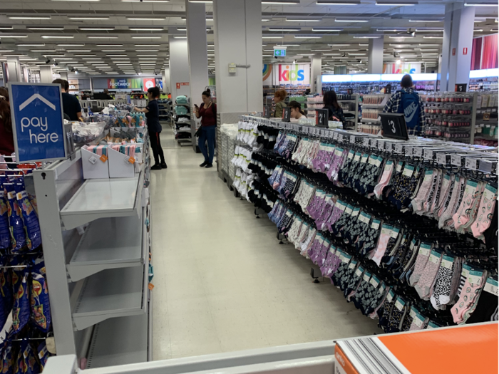 I made my way down the curved checkout line, where I was met with yet another love of mine: socks. I had to keep my student budget in mind and continue through the line to the self-checkout station.