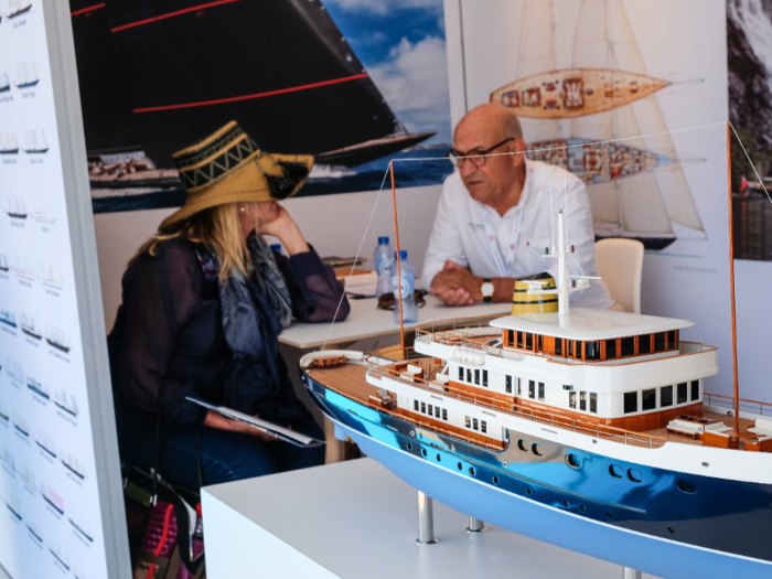 Yachting industry insiders talked business in the exhibitor booths ...