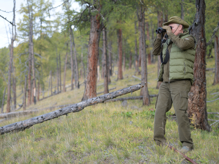 To match the gentle pace of this trip, Putin was equipped with binoculars and walking poles.