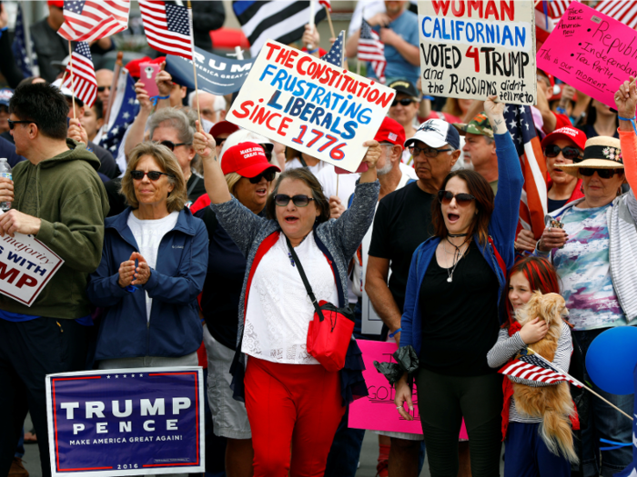 Here, women in California surge forward with their Trump signs held high.