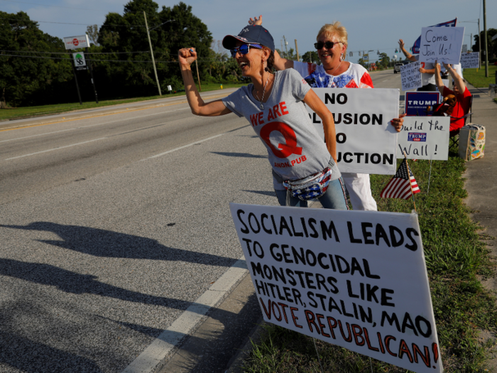 These Trump supporters, who are raising their fists to oncoming traffic, don