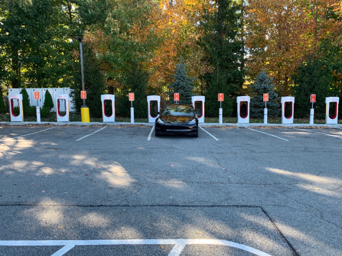 The station I chose was tucked into the corner of a strip mall parking lot, but the distinctive appearance of Tesla