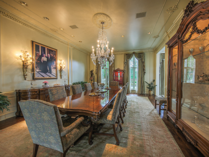 One of many dining rooms features another chandelier hanging over the table.