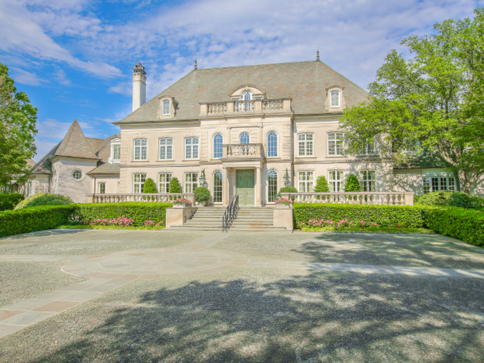 The two-story home has six bedrooms, 10 full bathrooms and 10 half bathrooms. It has both formal and informal dining areas, reception areas, home offices, a fitness room, and a screening room.