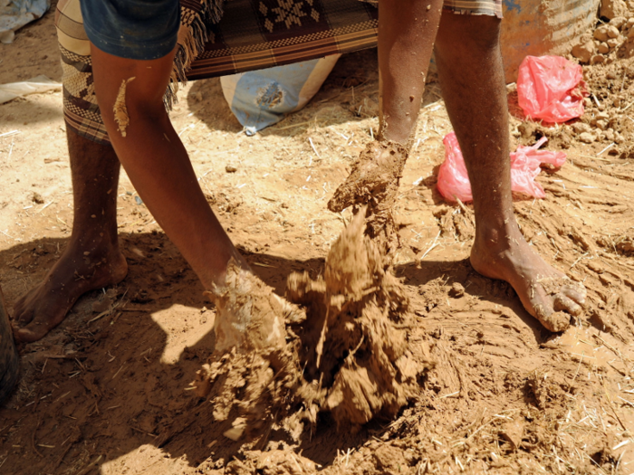 The towers need regular maintenance. Fresh coats of mud are applied to stop cracking and to maintain the walls