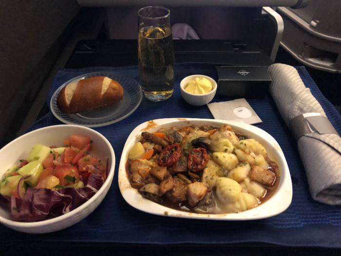 After a few hours of sleep, it was again time to eat. The final meal before landing was an option of pizza or chicken ragout with gnocchi and mixed vegetables. I picked the Gnocci; while it wasn