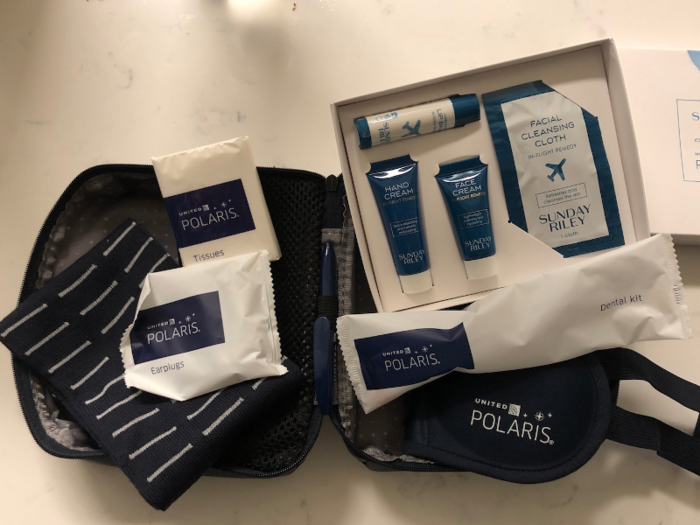 With the upgraded amenities in the bathroom, it was time to check out the amenity kit that was waiting for me back at my seat.  Everything was branded with Polaris — I